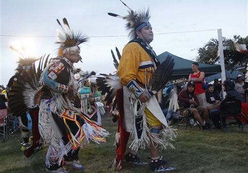 People perform during an event with the Fort Belknap Indian Reservation