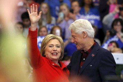 U.S. Democratic presidential candidate Hillary Clinton waves after being introduced by Bill Clinton during a campaign rally in Cedar Rapids, Iowa