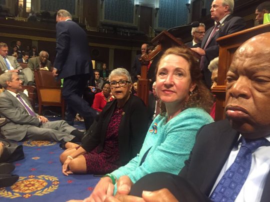 Democrats sitting on the floor