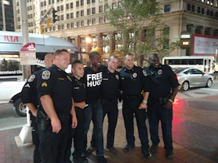 Free Hugs guy after hugging some cops / Stephen Gutowski