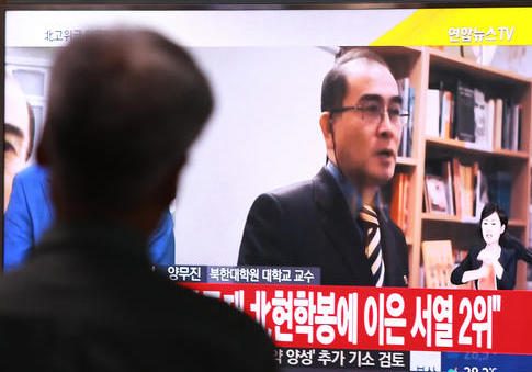 A TV news report airs an image of Thae Yong Ho in South Korea