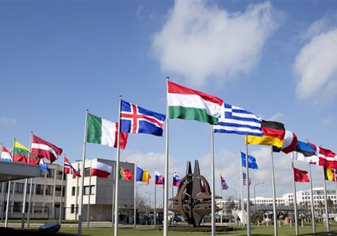 Flags flutter in the wind in front of NATO headquarters in Brussels