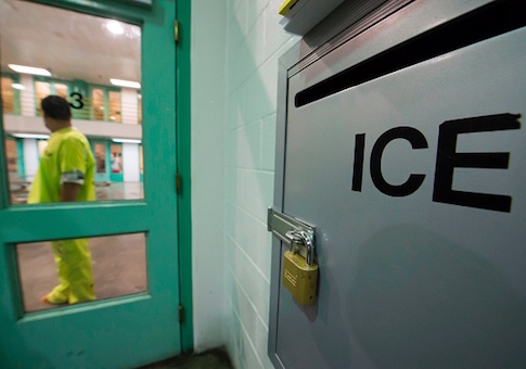 An immigration detainee stands near an US Immigration and Customs Enforcement (ICE) grievance box in the high security unit at the Theo Lacy Facility