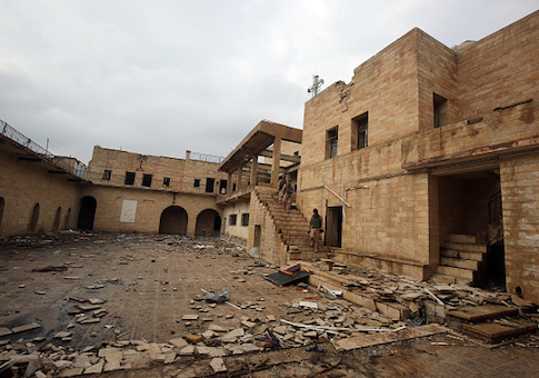 Iraqi soldiers inspect the debris at St. George's Monastery, a historical Chaldean Catholic church on the northern outskirt of Mosul, which was destroyed by ISIS