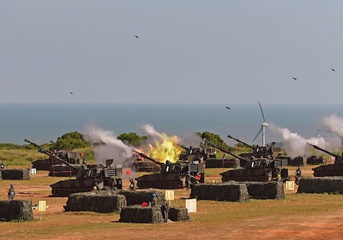 Taiwan military soldiers fire artillery shells from 38 eight-inch and 155-millimeter howitzers during the Han Kuang 31 live fire drill in Hsinchu, northern Taiwan