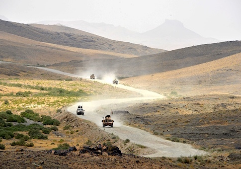 Afghan National Army (ANA) soldiers patrol the Shah Wali Kot district of Kandahar province