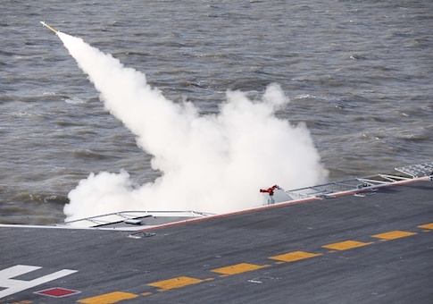 This picture taken on an undisclosed date in December 2016 shows a missile being fired from the Liaoning aircraft carrier during military drills in the Bohai Sea