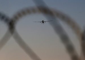 A U.S. Air Force MQ-1B Predator unmanned aerial vehicle flies over an air base after flying a mission in the Persian Gulf region