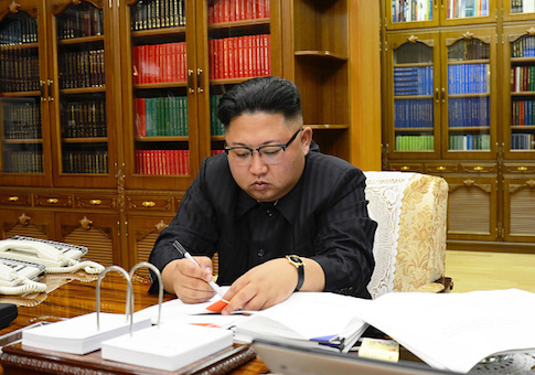Kim Jong-Un signs the order to carry out the test-fire of the intercontinental ballistic missile Hwasong-14 at an undisclosed location