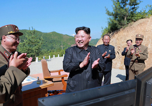 North Korean leader Kim Jong-Un celebrates the successful test-fire of the intercontinental ballistic missile Hwasong-14 at an undisclosed location