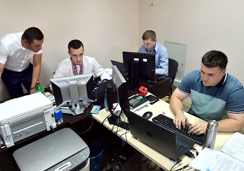 Officers of Ukrainian Cyberpolice Department work in an office in the department building in Kiev