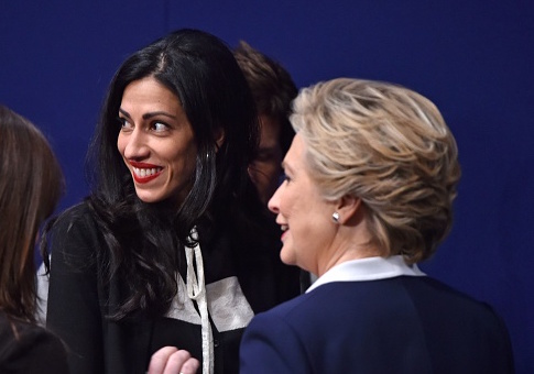 Huma Abedin with Hillary Clinton / Getty Images