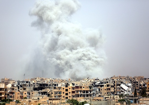 Smoke billows out from Raqa following a coalition air strike on July 28