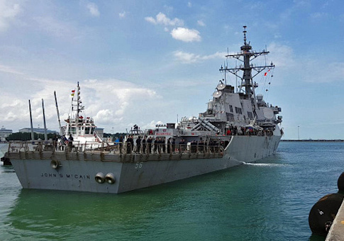 Guided-missile destroyer USS John S. McCain (DDG 56) arrives pier side at Changi Naval Base, Republic of Singapore following a collision