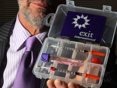 A doctor holds up a drug testing kit which is used as part of assisted suicides