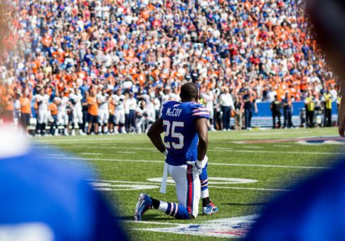 LeSean McCoy #25 of the Buffalo Bills takes a knee during the national anthem / Getty Images