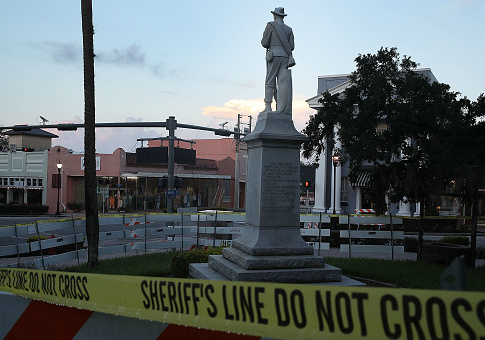 Barricades surround the Confederate monument in front of the Hernando County Courthouse to keep possible protesters away from the statue in the midst of a national controversy over whether Confederate symbols should be removed from public display on August 19, 2017 in Brooksville, Florida. The issue is at the heart of a debate about race in America and a recent protest in Charlottesville, VA turned deadly as white-supremacists clashed with counter-demonstrators over a confederate statue. / Getty Images