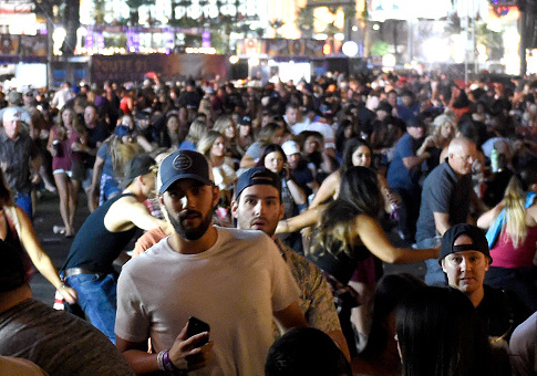 People flee the Route 91 Harvest country music festival grounds / Getty Images
