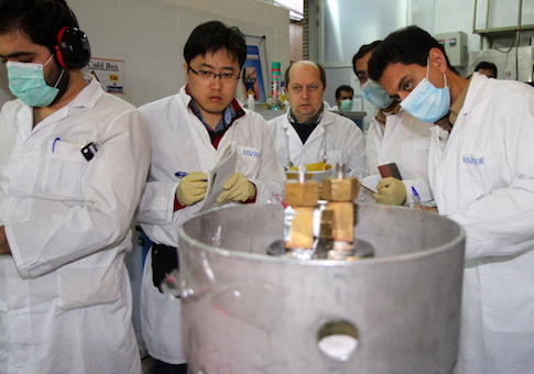 International Atomic Energy Agency inspectors and Iranian technicians at a nuclear power plant of Natanz