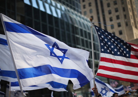 Pro-Israel demonstrators wave flags during a rally in Chicago