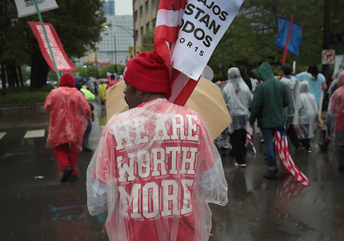 Demonstrators fighting for a $15-per-hour minimum wage march