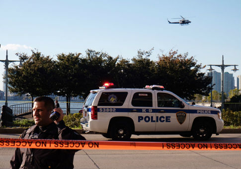 Police gather at scene after a truck plowed through a bike path in lower Manhattan / Getty