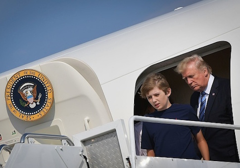 President Donald Trump and Barron Trump step out of Air Force One