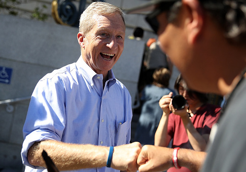 Tom Steyer at a rally and press conference with San Francisco supervisor Sandra Lee, author of a resolution calling on U.S. Congress to initiate impeachment proceedings / Getty Images