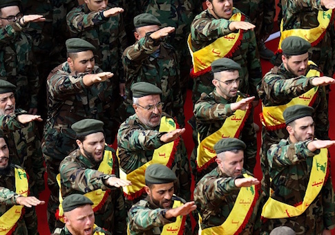 Members of Lebanon's Shiite Hezbollah movement salute