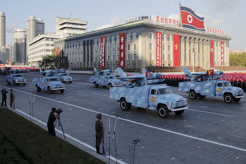 Trucks carry drones under a stand with North Korean leader Kim Jong Un and other officials during the parade celebrating the 70th anniversary of the founding of the ruling Workers' Party of Korea, in Pyongyang