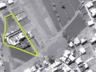 An aerial view, released by the United State Department of Defense May 2, 2011, shows the compound (highlighted) that Osama bin Laden was killed in. Abbottabad, Pakistan. / Reuters