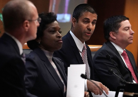 Federal Communications Commission Chairman Ajit Pai speaks as commission members listen during a commission meeting