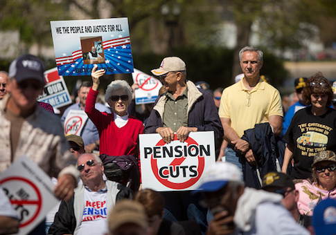Attendees rally on the West Front of the U.S. Capitol building with Teamsters Union retirees who traveled from across the country to voice their opposition to deep cuts to their pension benefits