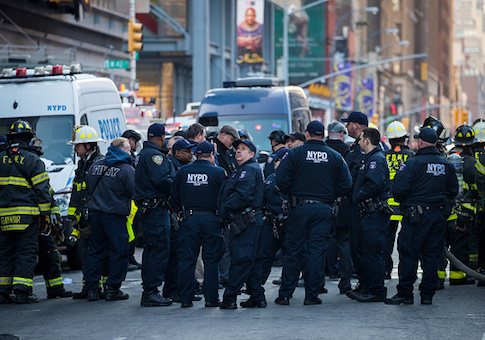 New York City Police Department officers and other first responders work the scene after an attempted terror attack in a passageway linking the Port Authority Bus Terminal with the subway