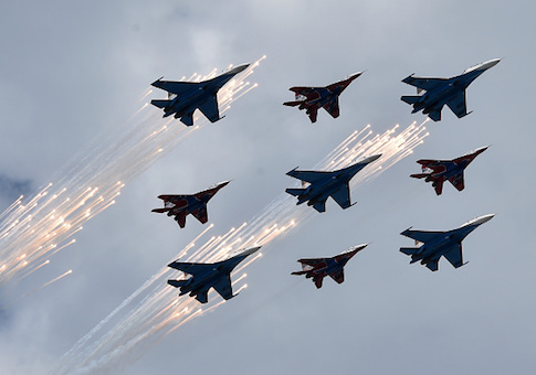 Russian Su-27 jet fighters and MIG 29 jet fighters fly above the Red Square during the Victory Day military parade general rehearsal in Moscow