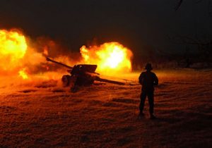 An Afghan National Army soldier fires an artillery shell during an ongoing anti-Taliban operation at Farah province