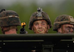 US marines ride on an Amphibious Assault vehicle during a beach landing exercise at a naval training base