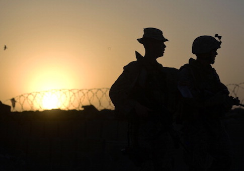 US Marines from 1st Battalion 7th Marines Regiment walk at dusk in Afghanistan