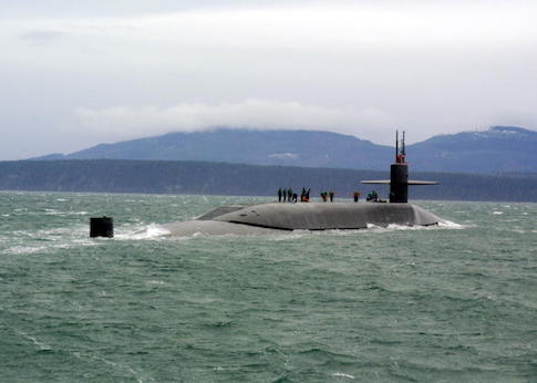 The guided missile submarine USS Ohio (SSGN 726) stops for a personnel boat transfer