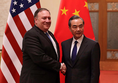 U.S. Secretary of State Mike Pompeo shakes hands with Chinese Foreign Minister Wang Yi