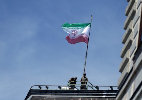 FILE PHOTO: The national flag of Iran is seen on top of the Austrian Chancellery during the visit of President Hassan Rouhani in Vienna