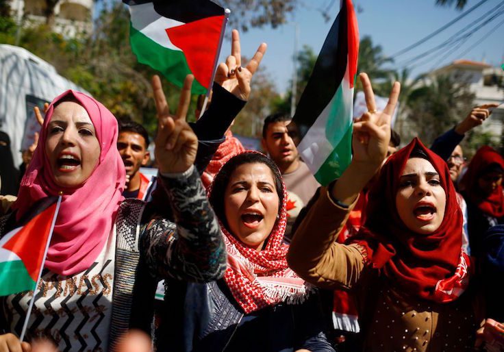 Palestinian women shout anti-Israeli slogans during a rally