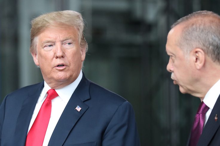 President Donald Trump talks to Turkey’s President Recep Tayyip Erdogan at NATO headquarters in Brussels