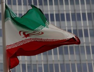 FILE PHOTO: An Iranian flag flutters in front of the IAEA headquarters in Vienna