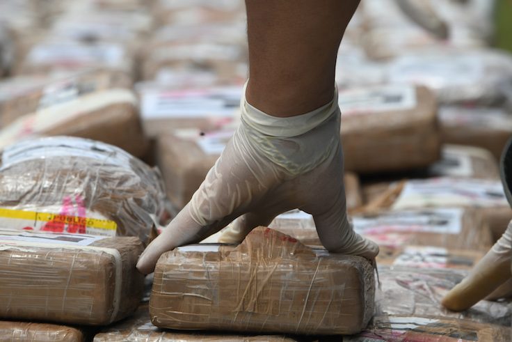 Authorities incinerate a load of cocaine seized to two Colombian nationals navigating along the Caribbean, in Tegucigalpa, on July 11, 2017. / AFP PHOTO / ORLANDO SIERRA (Photo credit should read ORLANDO SIERRA/AFP via Getty Images)