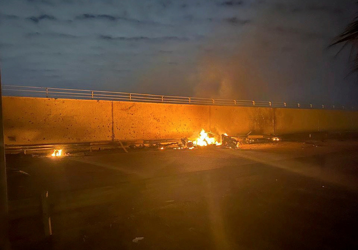Burning debris are seen on a road near Baghdad International Airport, which according to Iraqi paramilitary groups were caused by three rockets hitting the airport in Iraq