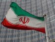 An Iranian flag flutters in front of the IAEA headquarters in Vienna