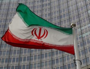 An Iranian flag flutters in front of the IAEA headquarters in Vienna