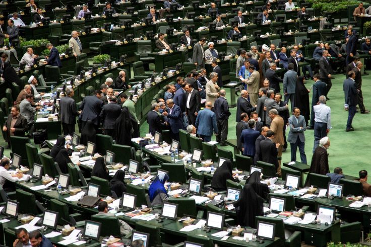 Iranian lawmakers attend a session of parliament in Tehran