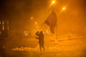 Anti-government protesters and riot police clash during a second day of violence, on January 22, 2020 in Beirut, Lebanon